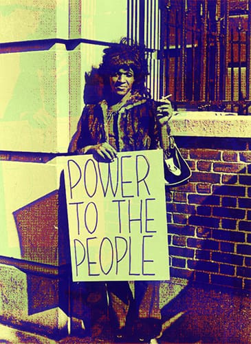 Marsha P Johnson with a Power to the people sign